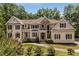 Charming two-story home with manicured lawn and lush landscaping at 912 Chipley Ct, Marietta, GA 30062
