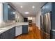 Open kitchen boasts stainless-steel appliances, granite countertops, and seamless transition to the living area at 912 Chipley Ct, Marietta, GA 30062