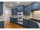 Kitchen featuring stone countertops, stainless appliances and light fixtures at 912 Chipley Ct, Marietta, GA 30062