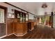 Bright living room with hardwood flooring, a bar area with stools, and a relaxing atmosphere with a view of the forest at 912 Chipley Ct, Marietta, GA 30062