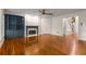 Hardwood floors, fireplace, and large built-in shelves highlight this expansive living area at 912 Chipley Ct, Marietta, GA 30062