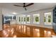 Open living room showcasing hardwood floors, built-in shelves, and a view of the kitchen and backyard at 912 Chipley Ct, Marietta, GA 30062