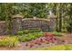 Stoneoak Pointe community entrance with stone signage and colorful landscaping, creating an inviting and upscale welcome at 912 Chipley Ct, Marietta, GA 30062