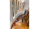 Elegant winding staircase with natural light pouring through multiple windows and hardwood steps at 912 Chipley Ct, Marietta, GA 30062