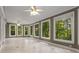 Open sunroom with abundant natural light, tiled flooring, and neutral walls and ceilings at 912 Chipley Ct, Marietta, GA 30062