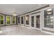 Sunroom features tiled flooring, plenty of windows, and patio doors leading to the home at 912 Chipley Ct, Marietta, GA 30062