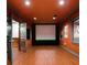 Home theater room featuring a large screen, hardwood floors, and dark walls for optimal viewing at 912 Chipley Ct, Marietta, GA 30062