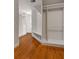 Spacious walk-in closet has built-in shelving and drawers with wood flooring and natural lighting at 912 Chipley Ct, Marietta, GA 30062