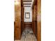 Custom wine cellar featuring wood racking, tile flooring, and a built in bar area for convenient wine storage at 912 Chipley Ct, Marietta, GA 30062