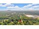 An aerial view shows the home's location in a community near retail and green spaces at 19 Quail Hollow Ct, Dallas, GA 30157