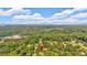 An aerial view highlights the home's location within a lush, wooded neighborhood at 19 Quail Hollow Ct, Dallas, GA 30157