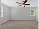 Large bedroom featuring carpet floors, a ceiling fan, and natural light at 19 Quail Hollow Ct, Dallas, GA 30157