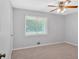 Bedroom featuring neutral carpet, a ceiling fan and natural light at 19 Quail Hollow Ct, Dallas, GA 30157