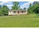 Charming ranch home with a welcoming front porch and large manicured front lawn at 19 Quail Hollow Ct, Dallas, GA 30157
