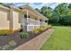 Landscaped front yard featuring mulch beds lining the home and a sidewalk to the entrance at 19 Quail Hollow Ct, Dallas, GA 30157