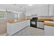 Kitchen with white cabinets, butcher block counters, and stainless steel appliances at 19 Quail Hollow Ct, Dallas, GA 30157