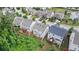 An aerial view of a neighborhood, featuring homes with spacious yards and mature trees at 2013 Chesley Dr, Austell, GA 30106