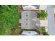 Aerial view of home features a well-maintained roof, trees, and a paved driveway at 2013 Chesley Dr, Austell, GA 30106