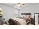 Cozy bedroom with a ceiling fan, natural light, and space for a dresser and TV at 2013 Chesley Dr, Austell, GA 30106