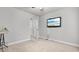 Bedroom features a TV mounted on the wall, and an open doorway to a bathroom at 2013 Chesley Dr, Austell, GA 30106