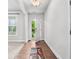 Bright entryway with wood floors, neutral walls, and a view of the front yard through the open door at 2013 Chesley Dr, Austell, GA 30106