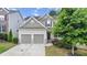 Charming two-story home with a two-car garage and beautifully landscaped front yard at 2013 Chesley Dr, Austell, GA 30106