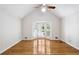 Empty bedroom with hardwood floors, bay window, and vaulted ceiling, offering a serene space at 2611 Leeshire Ct, Tucker, GA 30084