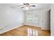 Well-lit bedroom with hardwood floors and a window, creating a cozy and comfortable atmosphere at 2611 Leeshire Ct, Tucker, GA 30084