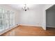 Dining room with hardwood floors and large window, providing a bright and inviting space for meals at 2611 Leeshire Ct, Tucker, GA 30084