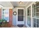 Inviting front door with a wreath, sidelight windows and a brick facade at 2611 Leeshire Ct, Tucker, GA 30084