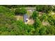 Aerial view of the house surrounded by lush greenery and tall trees at 428 Hulseytown Rd, Dallas, GA 30157
