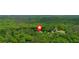 Aerial view of the home amidst a lush landscape with mature trees at 428 Hulseytown Rd, Dallas, GA 30157