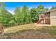 Beautiful backyard with a wood fence, green grass, and a covered deck at 428 Hulseytown Rd, Dallas, GA 30157