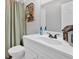 Bathroom with neutral colors, modern sink and a basket with a plant at 428 Hulseytown Rd, Dallas, GA 30157