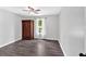 Neutral bedroom with dark wood floors, large closet and bright window at 428 Hulseytown Rd, Dallas, GA 30157
