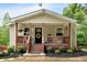Charming home exterior featuring a cozy front porch with wood railings and a welcoming yellow wreath at 428 Hulseytown Rd, Dallas, GA 30157