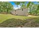 View of yard featuring home's exterior, showcasing an expansive lawn and a classic wooden fence for privacy at 428 Hulseytown Rd, Dallas, GA 30157