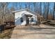 Charming single-story home with a welcoming front porch and a well-maintained yard at 4286 Pool Rd, Winston, GA 30187