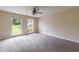 Neutral bedroom features plush carpet and double windows overlooking the yard at 10247 Deep Creek Pl, Union City, GA 30291