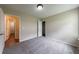 This bedroom features neutral walls, plush gray carpeting, and an ensuite bathroom for added convenience at 10247 Deep Creek Pl, Union City, GA 30291