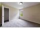 Bedroom featuring neutral walls, one window, and gray carpet flooring at 10247 Deep Creek Pl, Union City, GA 30291