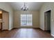 Formal dining room with a stylish chandelier, hardwood floors, and bright natural light at 10247 Deep Creek Pl, Union City, GA 30291