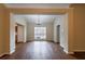 Dining room featuring hardwood floors, chandelier, and a large window providing natural light at 10247 Deep Creek Pl, Union City, GA 30291