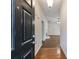 A home's entryway reveals hardwood flooring and transitions to a living space with natural light at 10247 Deep Creek Pl, Union City, GA 30291