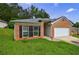 Charming single-story home with a brick facade, a two-car garage, and a well-maintained lawn at 10247 Deep Creek Pl, Union City, GA 30291