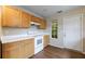 Charming kitchen with natural wood cabinets and white countertops at 10247 Deep Creek Pl, Union City, GA 30291