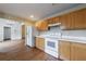 Bright kitchen with wood look floors, white countertops and white cabinets at 10247 Deep Creek Pl, Union City, GA 30291