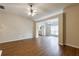 The open-concept living room showcases hardwood floors, a ceiling fan, and lots of natural light at 10247 Deep Creek Pl, Union City, GA 30291