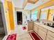 Well-lit bathroom with a shower, tub, vanity, and sink at 1902 Commons View Cir, Snellville, GA 30078