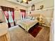 Comfortable bedroom featuring a ceiling fan and a decorative window with a padded ledge at 1902 Commons View Cir, Snellville, GA 30078